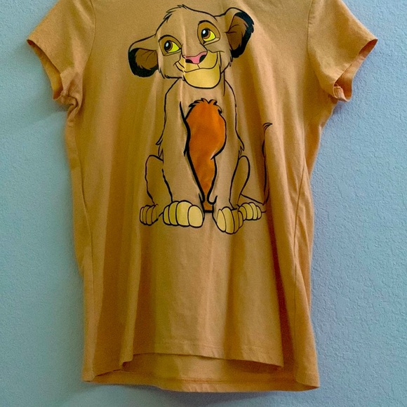 It’s a yellow Lion king theme shirt. With a hood.
